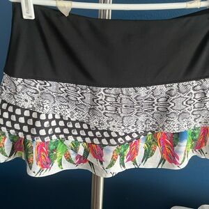 Lucky In Love tennis skirt with attached shorts. Size L